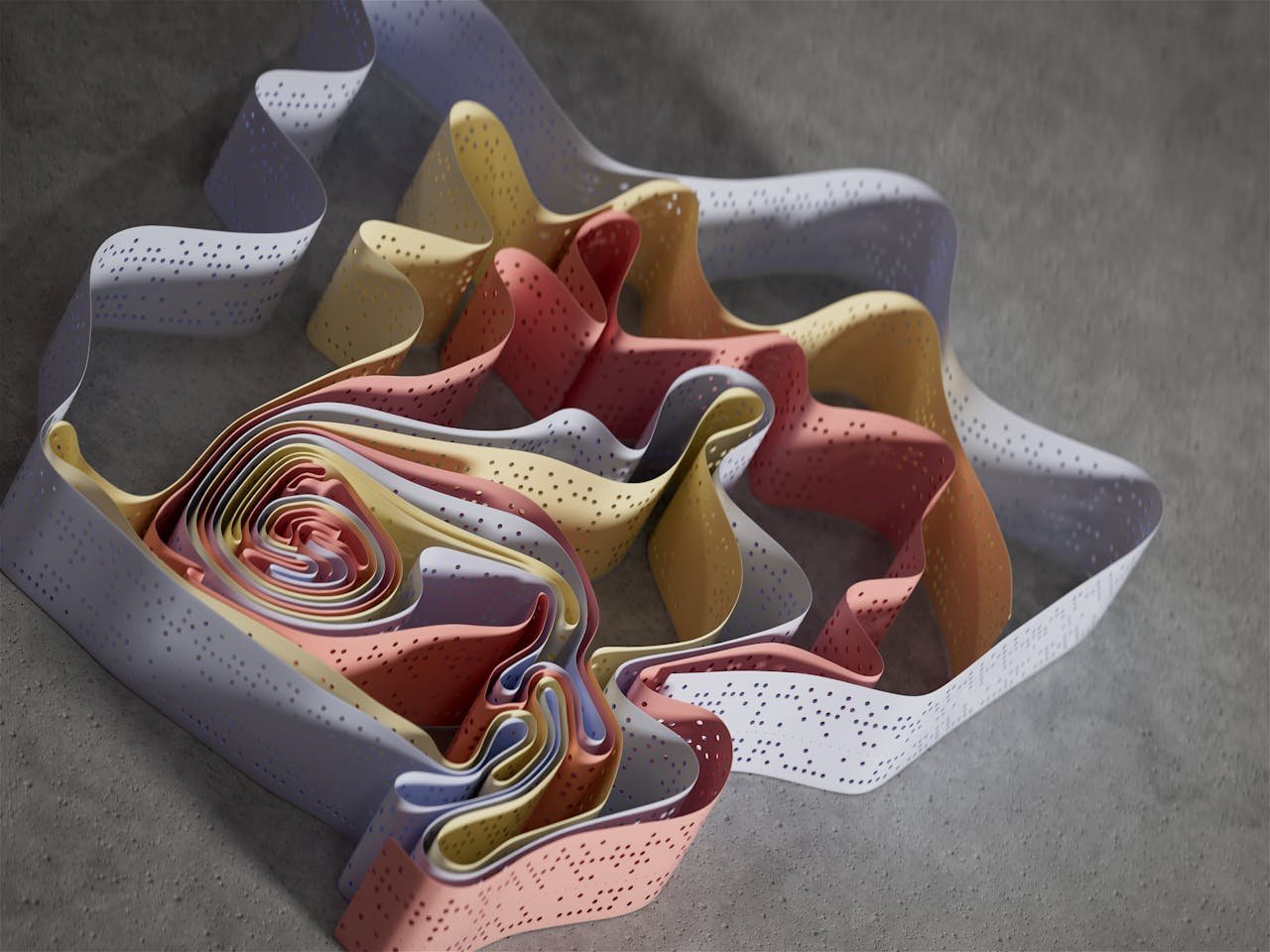Multicolored ribbons create a flowing abstract design on a grey background.