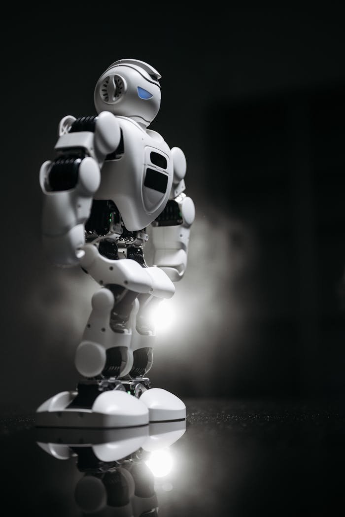 A sleek white robot standing on a reflective surface, exuding innovation and futurism.